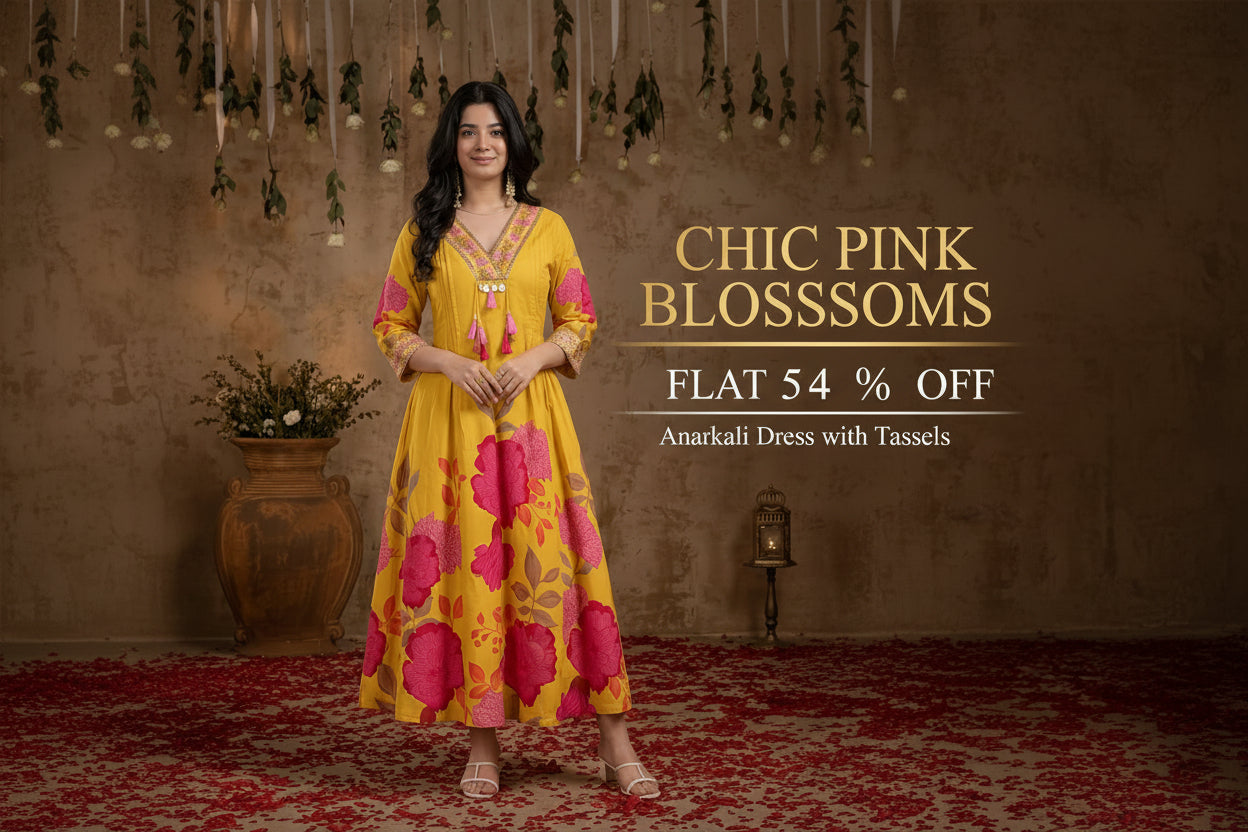 Woman in a yellow anarkali dress with pink floral patterns standing in a decorative setting with text about a discount offer.